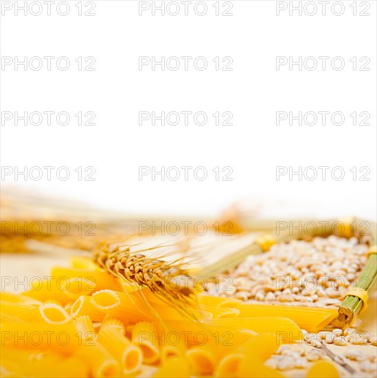 Short Italian pasta penne with durum wheat grains