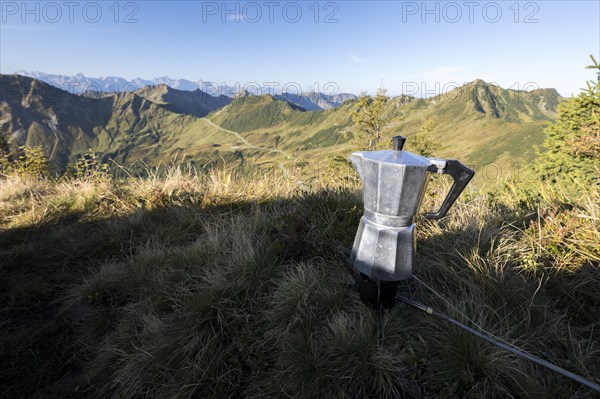 Espresso pot on a gas cooker in the morning light