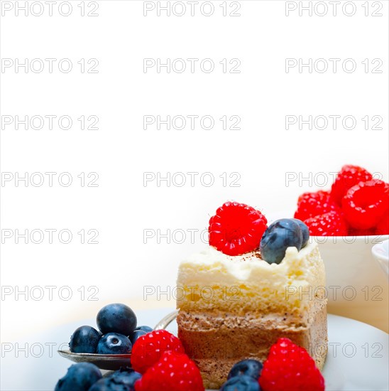 Fresh homemade raspberry and blueberry cream cake