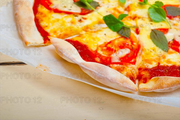 Italian traditional pizza Margherita tomato mozzarella and basil