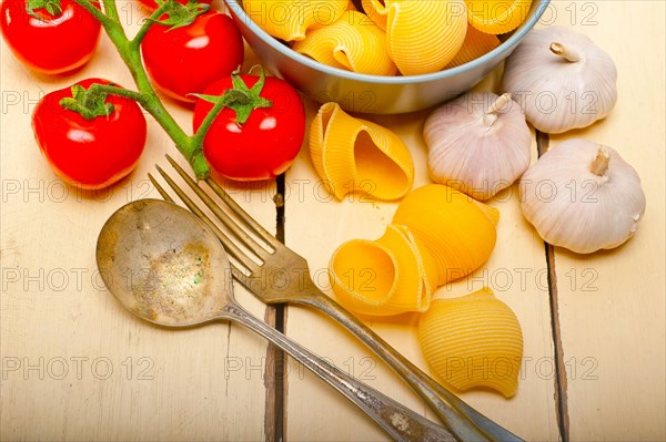 Italian snail lumaconi pasta with ripe cherry tomatoes sauce ingredients