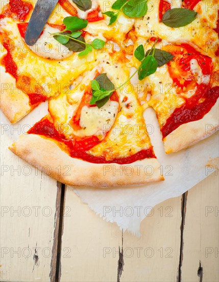 Italian traditional pizza Margherita tomato mozzarella and basil