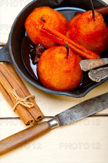 Poached pears delicious home made recipe ove white rustic wood table