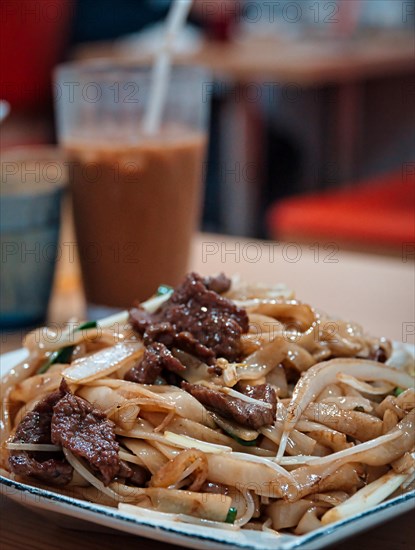 Stir-fried rice noodles with beef in a Cantonese restaurant in Macau