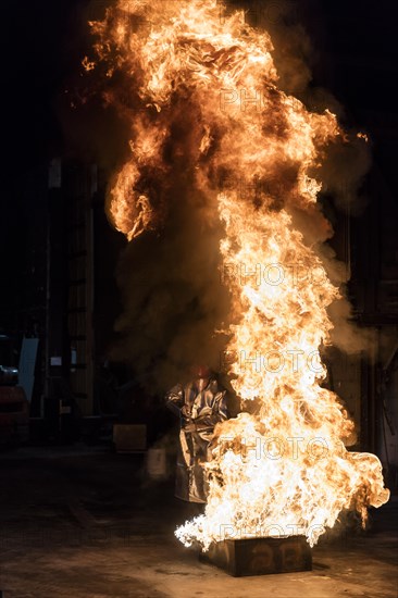 Firefighter extinguishes a heptane 2B-Pan fire with a 2-BTP extinguisher