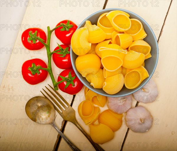 Italian snail lumaconi pasta with ripe cherry tomatoes sauce ingredients