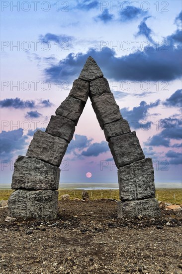 Monumental stone gate in barren landscape