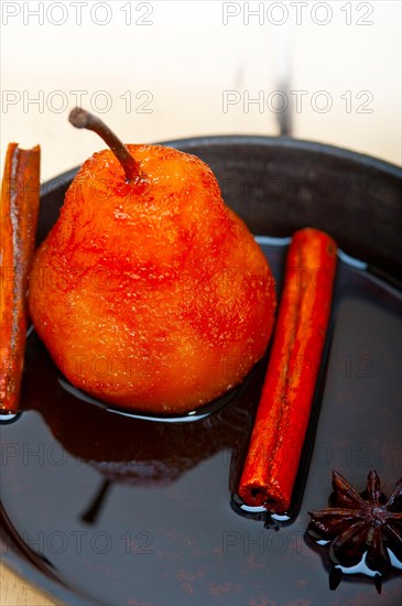 Poached pears delicious home made recipe ove white rustic wood table