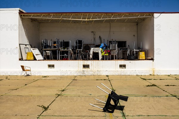 Pattern of messy chairs and tables in outdoor storage in Farol island