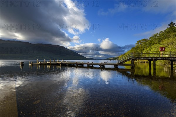 Wooden jetty on lake at morning