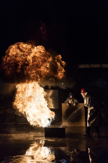 Firefighter extinguishes a heptane 2B-Pan fire with a 2-BTP extinguisher