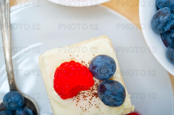 Fresh homemade raspberry and blueberry cream cake