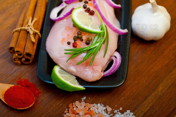 Fresh organic chicken breast with herbs and spices