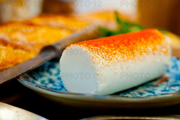 French cheese and fresh baguette on a wood cutter