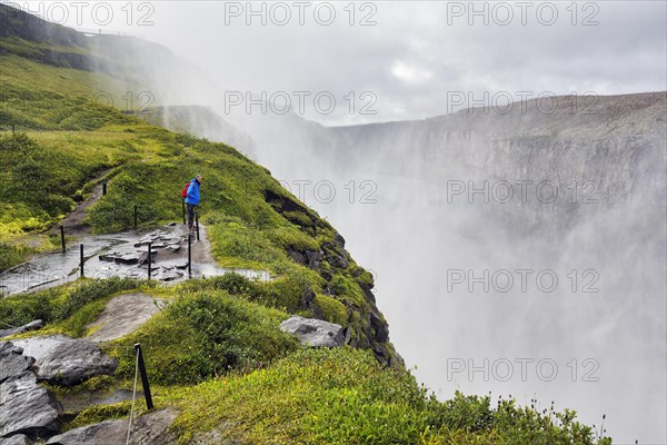 Hiker at the edge of Dettifoss