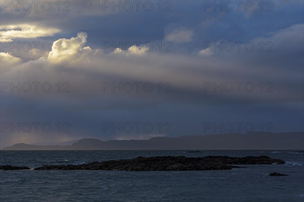 Scottish coast at sunset with sunrays