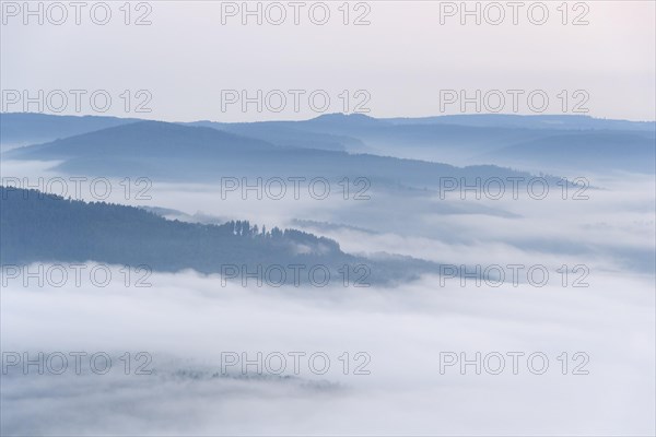 View from Katzenbuckel mountain with morning mist