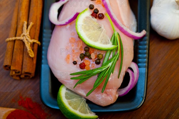 Fresh organic chicken breast with herbs and spices