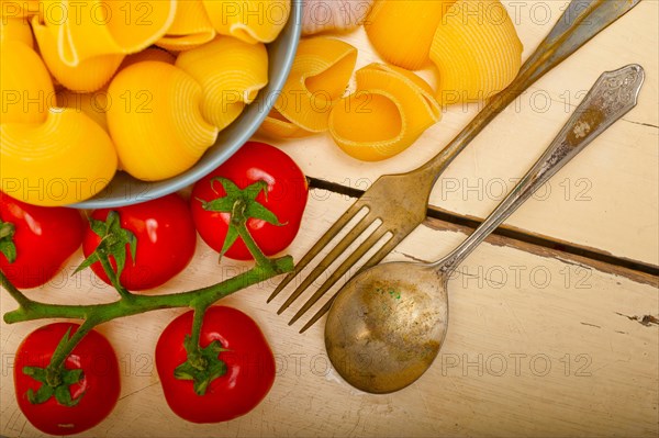 Italian snail lumaconi pasta with ripe cherry tomatoes sauce ingredients