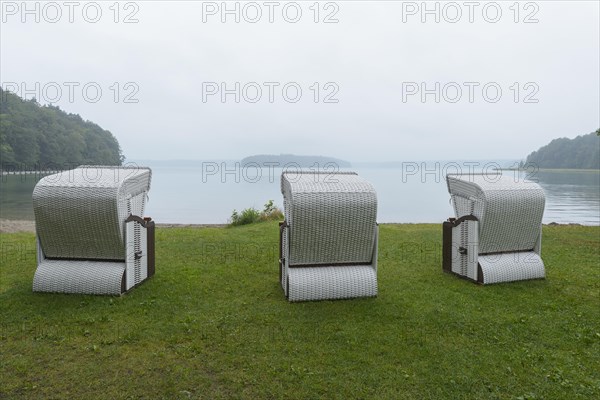 Lakeshore with beach chairs in the morning