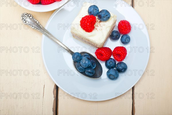 Fresh homemade raspberry and blueberry cream cake