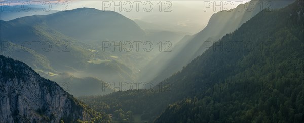 Morning atmosphere over the Val de Travers from the edge of the rocky basin at the Creux du Van