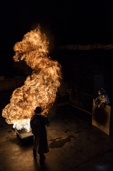 Firefighter extinguishes a heptane 2B-Pan fire with a 2-BTP extinguisher