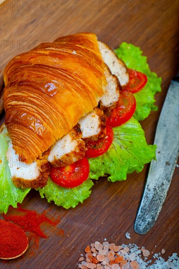 Savory croissant brioche bread with chicken breast and vegetable rustic style