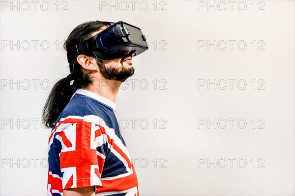 Man on white background with Virtual Reality headsets on