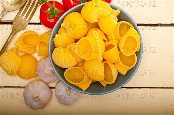 Italian snail lumaconi pasta with ripe cherry tomatoes sauce ingredients