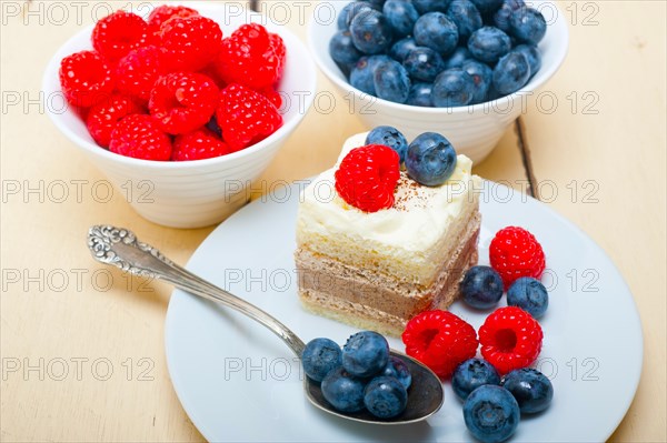 Fresh homemade raspberry and blueberry cream cake