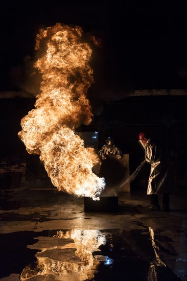 Firefighter extinguishes a heptane 2B-Pan fire with a 2-BTP extinguisher