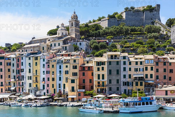 Pastel-coloured house facades in the harbour of Portovenere