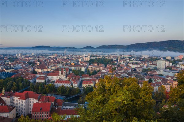 Cityscape of Graz with Mur river and Mariahilfer church