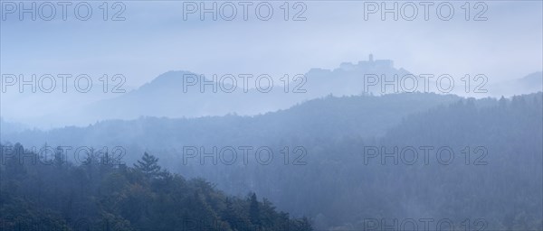 View from the Rennsteig over the Thuringian Forest to Wartburg Castle in the fog