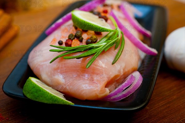 Fresh organic chicken breast with herbs and spices