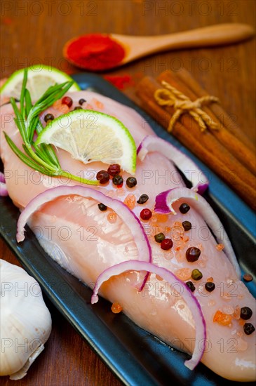 Fresh organic chicken breast with herbs and spices