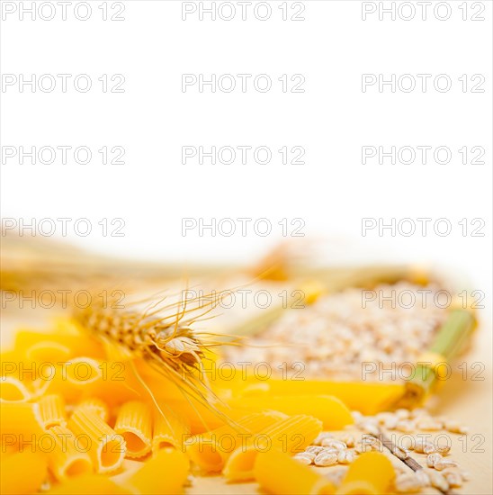 Short Italian pasta penne with durum wheat grains