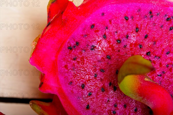 Fresh thai purple dragon fruit over white rustic table