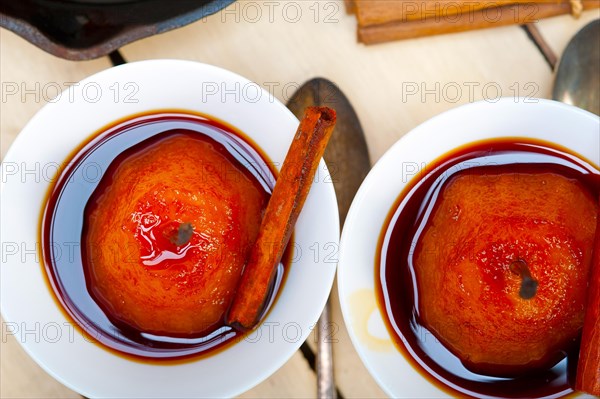 Poached pears delicious home made recipe ove white rustic wood table