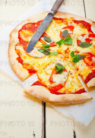 Italian traditional pizza Margherita tomato mozzarella and basil