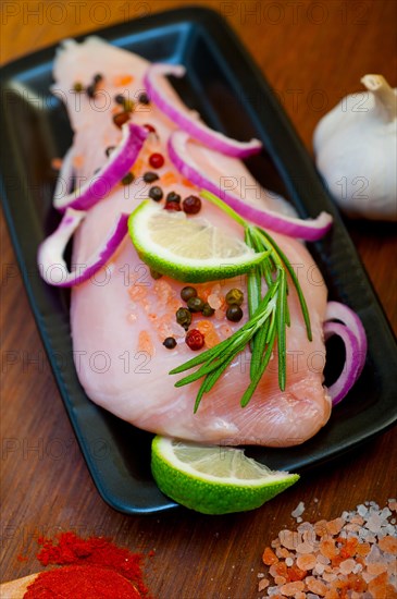 Fresh organic chicken breast with herbs and spices