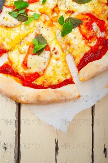 Italian traditional pizza Margherita tomato mozzarella and basil