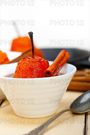 Poached pears delicious home made recipe ove white rustic wood table