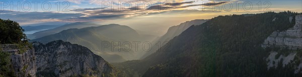 Morning atmosphere over the Val de Travers from the edge of the rocky basin at the Creux du Van