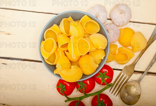 Italian snail lumaconi pasta with ripe cherry tomatoes sauce ingredients