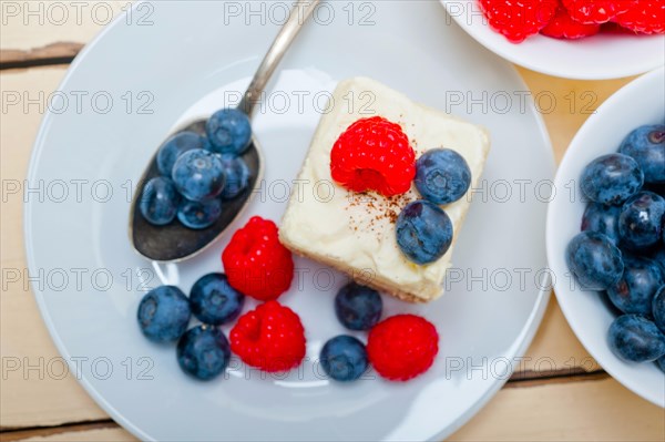 Fresh homemade raspberry and blueberry cream cake