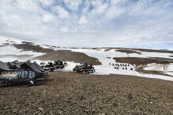 Snowmobiles in rows