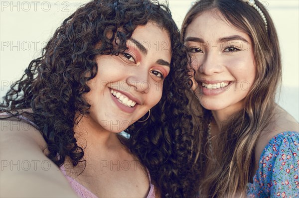 Close up of two cute girls taking a selfie