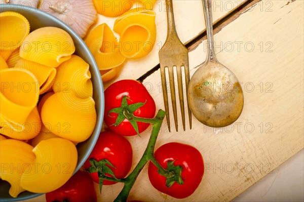 Italian snail lumaconi pasta with ripe cherry tomatoes sauce ingredients